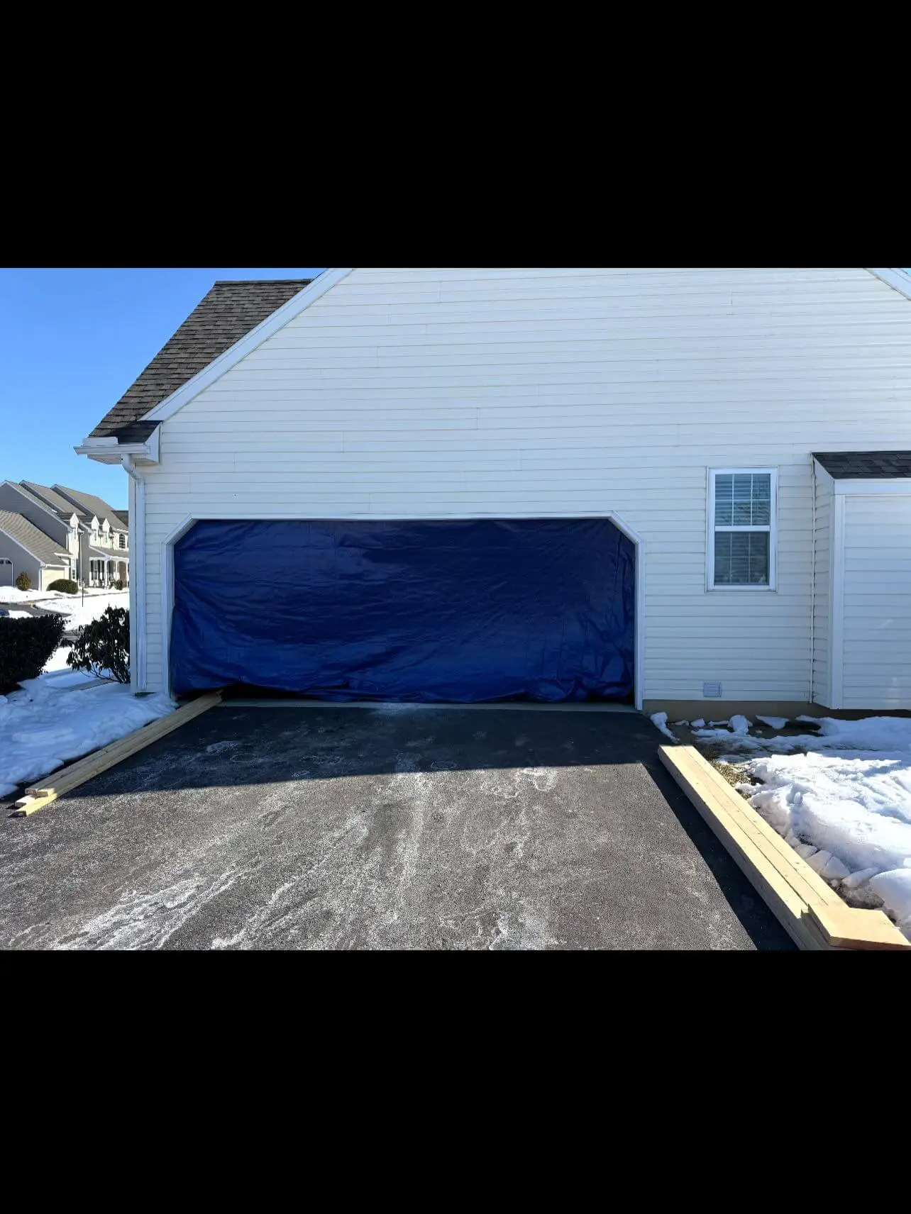 Converting two garage doors into one in progress